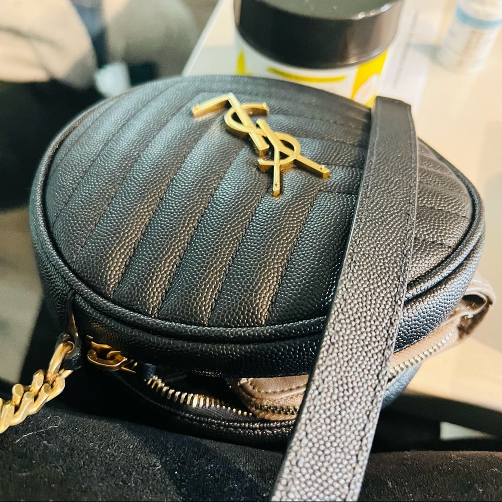 YSL ROUND CAMERA BAG LEATHER FEATURING A CHAIN AND LEATHER SHOULDER STRAP.